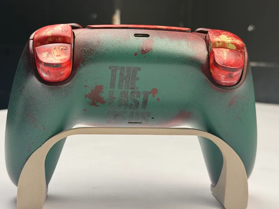 Hand-painted PS5 controller with a The Last of Us inspired design